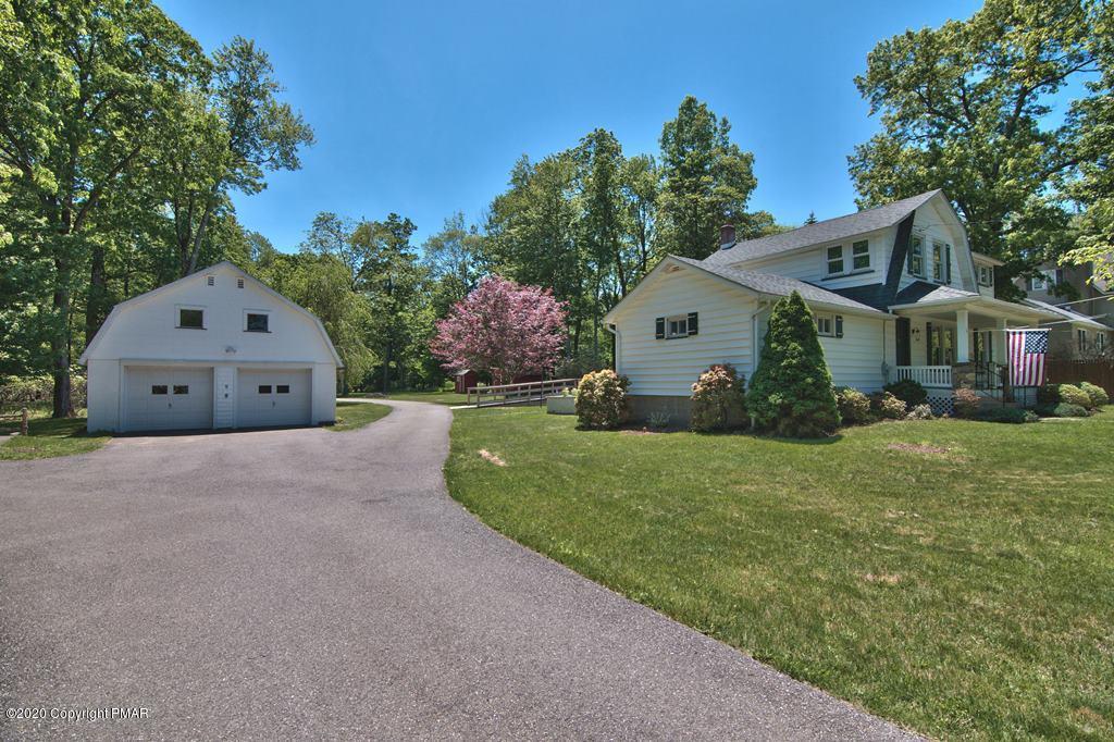 362 Upper Swiftwater Road Cresco, PA 18326 - Photo 86 of 87 a front view of a house with a garden and plants