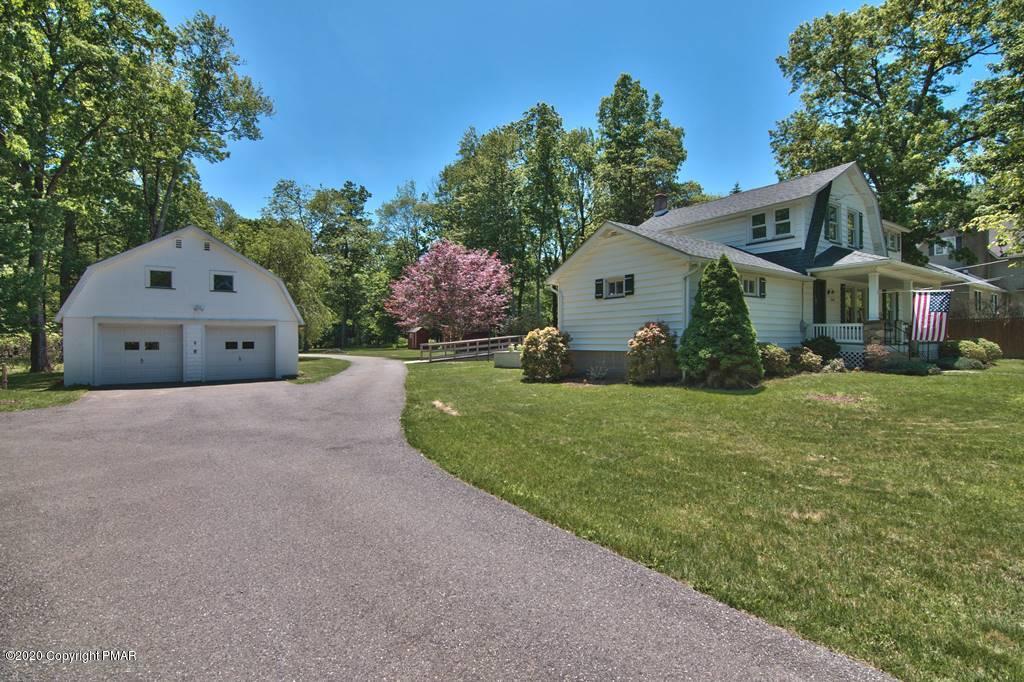 362 Upper Swiftwater Road Cresco, PA 18326 - Photo 87 of 87 a front view of a house with a yard and garage
