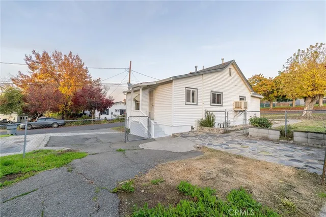 a view of a house with a yard and garage