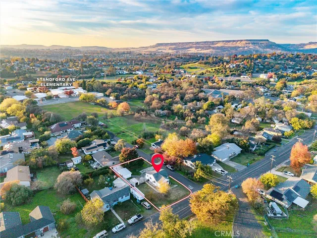an aerial view of residential building and car parked