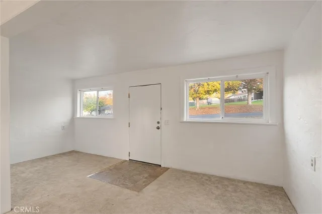 an empty room with windows