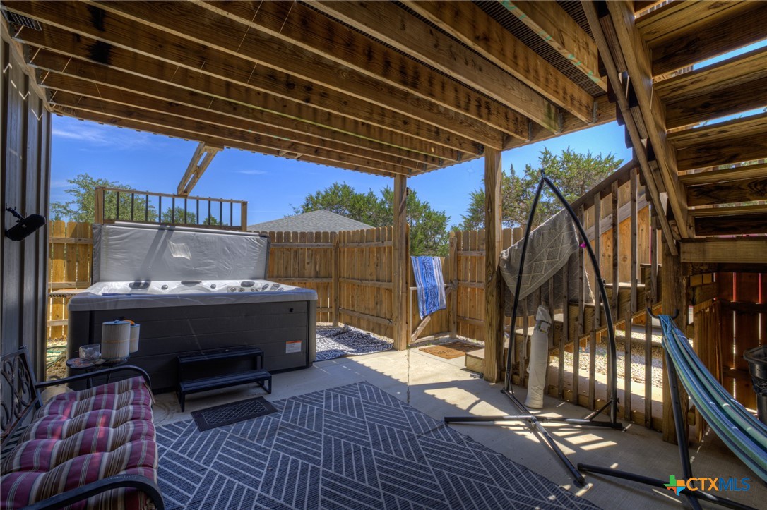 305 Lake Crest Spring Branch, TX 78070 - Photo 26 of 38 a view of barbeque area with wooden floor