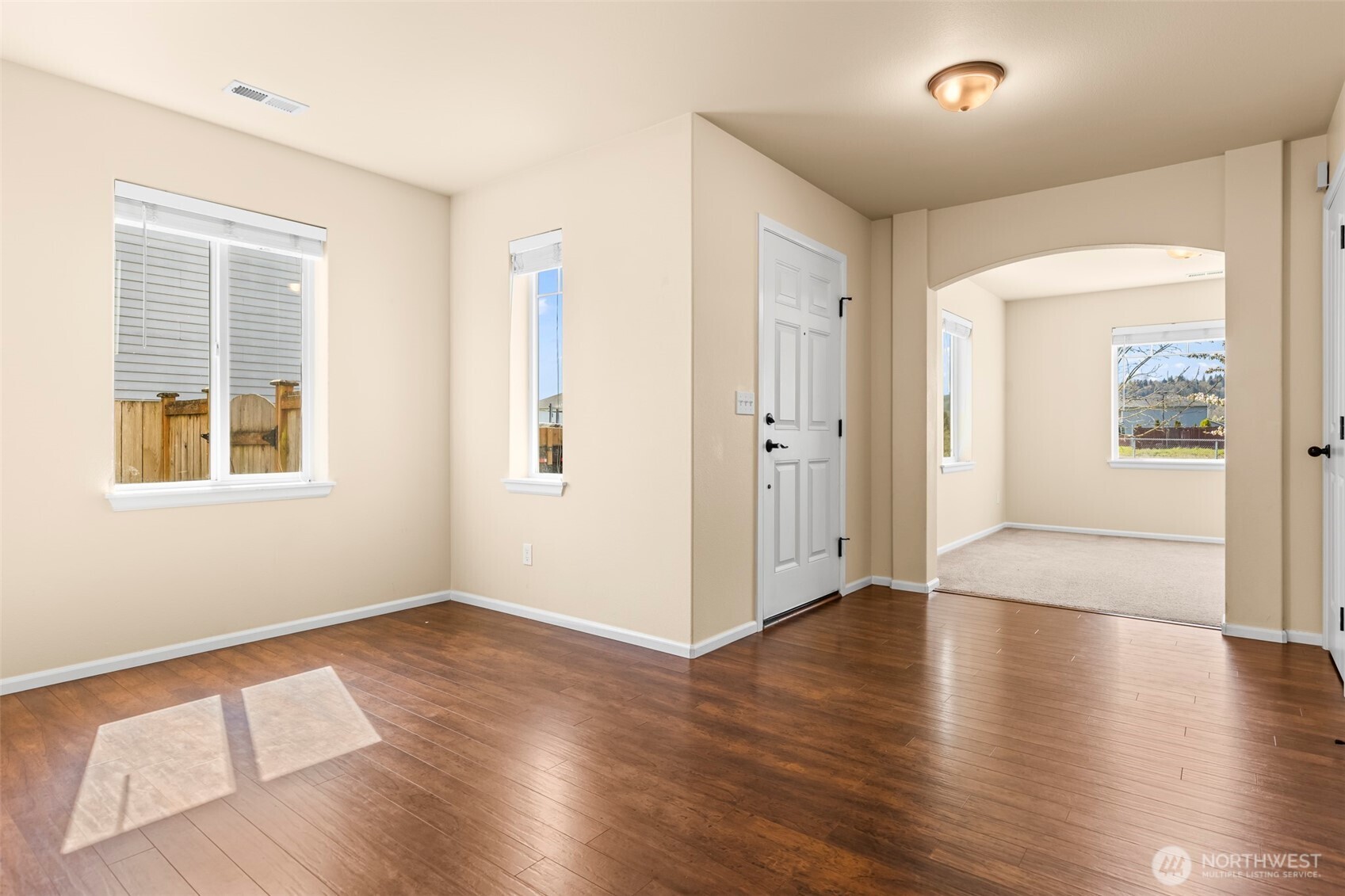 1408 Daffodil Avenue Northeast Orting, WA 98360 - Photo 13 of 37 an empty room with wooden floor and windows