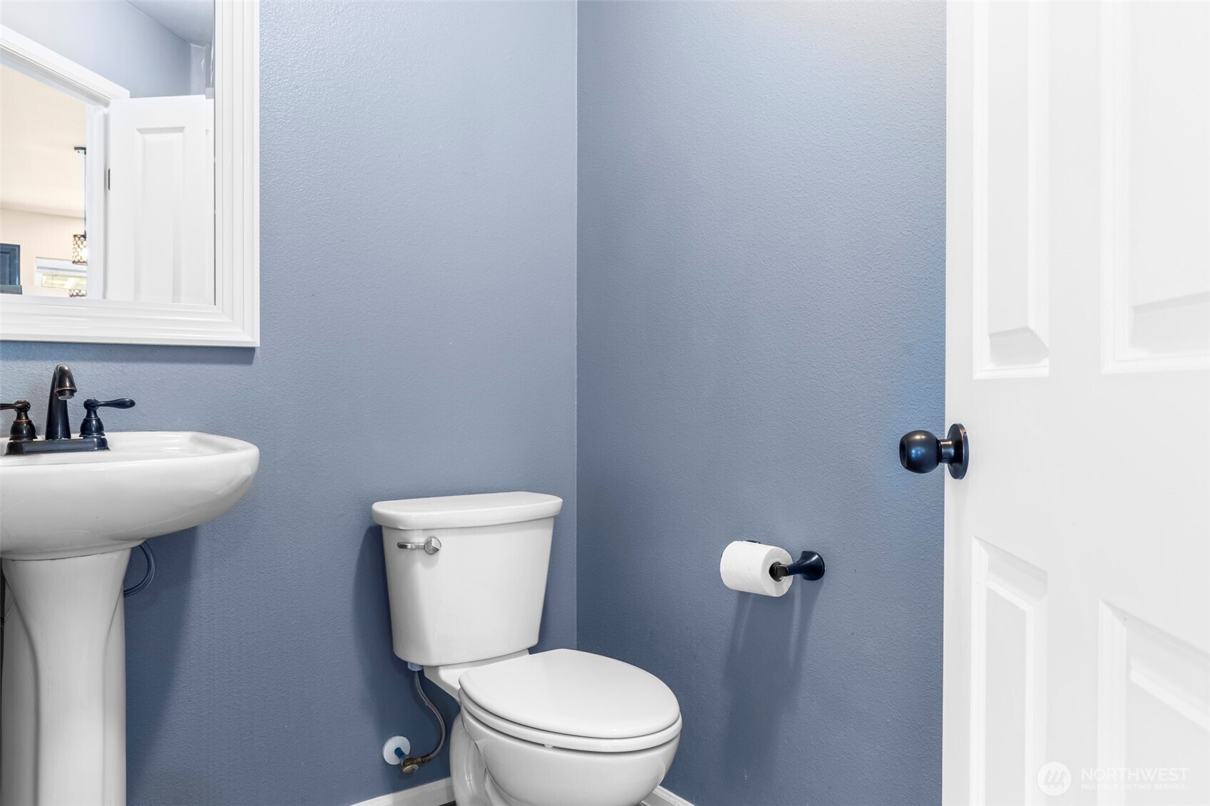 1408 Daffodil Avenue Northeast Orting, WA 98360 - Photo 14 of 37 a bathroom with a toilet a sink and mirror
