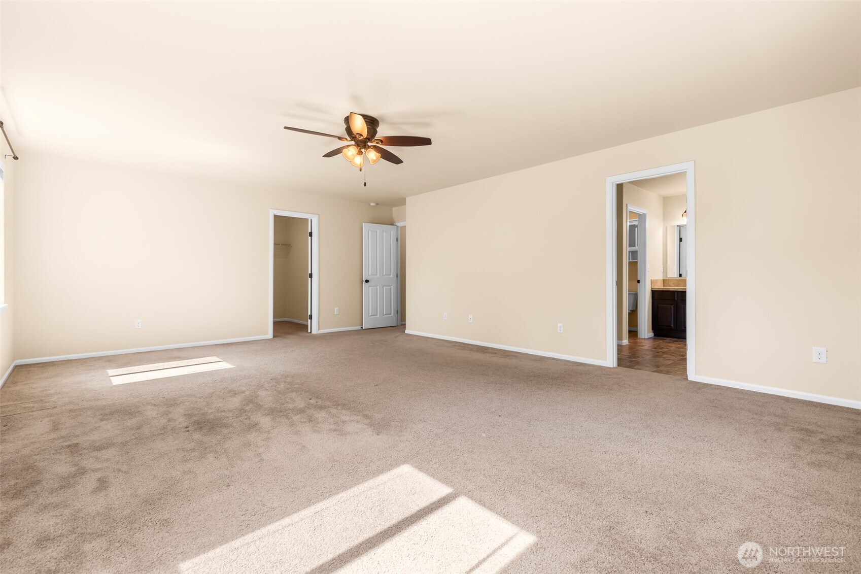 1408 Daffodil Avenue Northeast Orting, WA 98360 - Photo 18 of 37 a view of empty room with ceiling fan