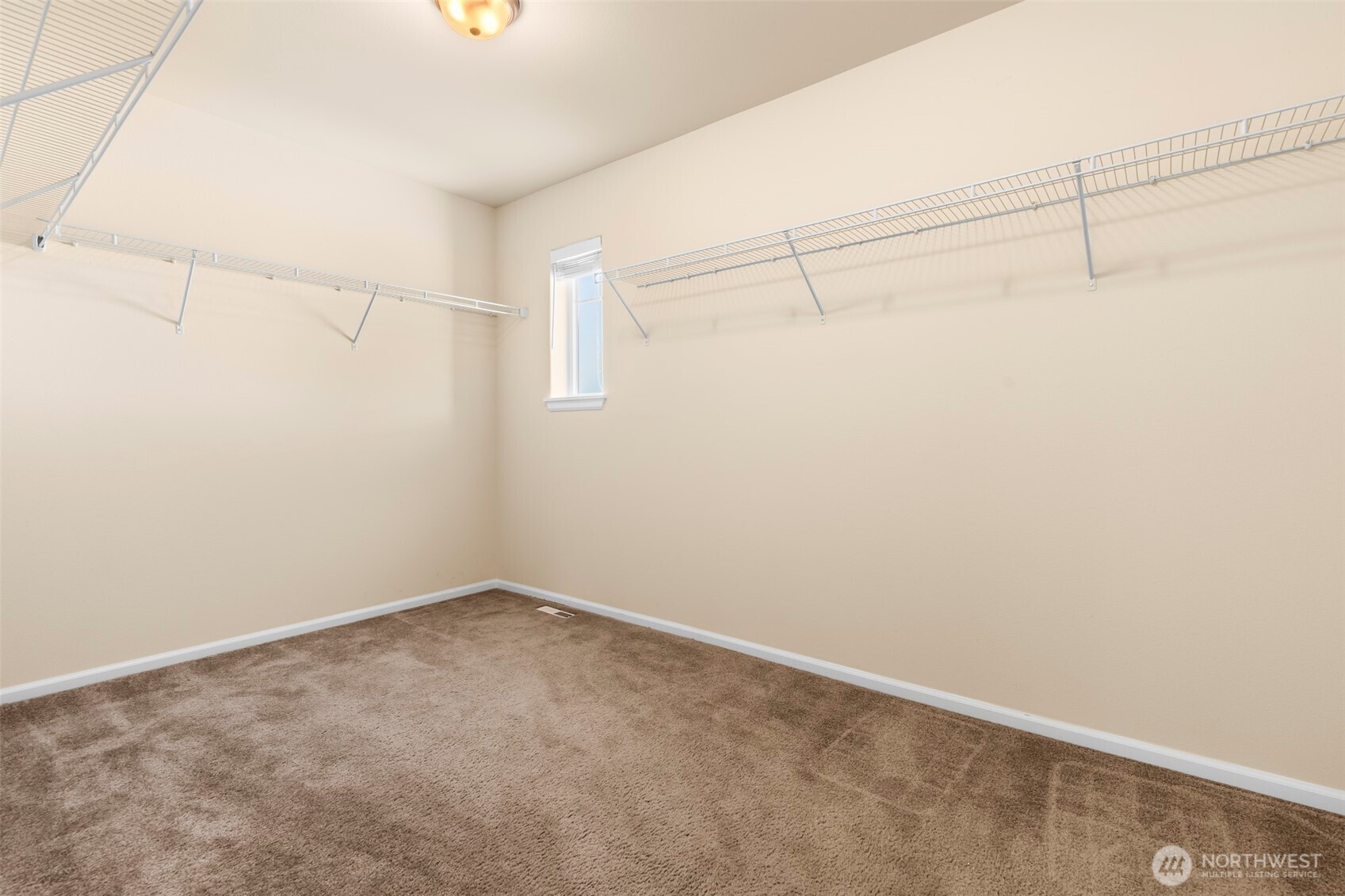 1408 Daffodil Avenue Northeast Orting, WA 98360 - Photo 19 of 37 a view of a room with racks on the wall
