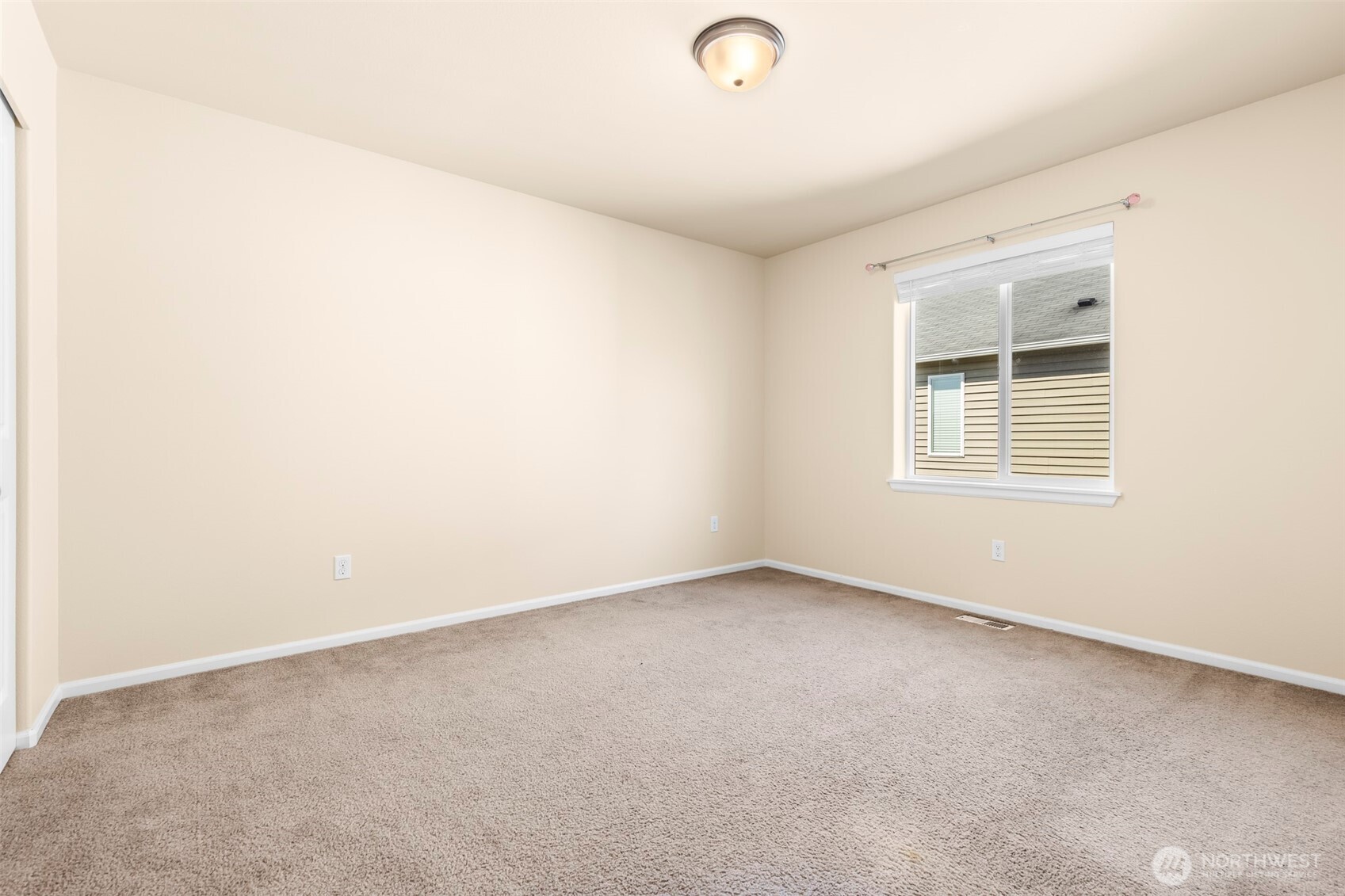 1408 Daffodil Avenue Northeast Orting, WA 98360 - Photo 23 of 37 an empty room with a window