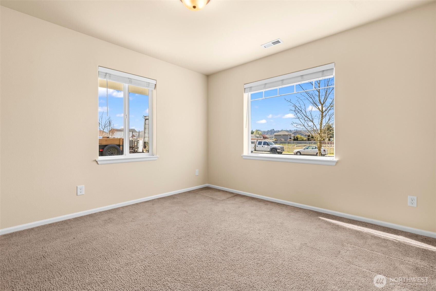 1408 Daffodil Avenue Northeast Orting, WA 98360 - Photo 25 of 37 an empty room with windows