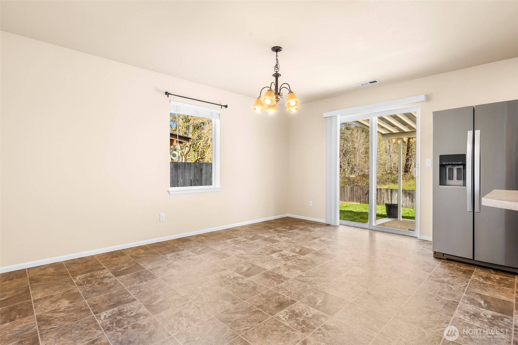 1408 Daffodil Avenue Northeast Orting, WA 98360 - Photo 6 of 37 a view of an empty room with a window