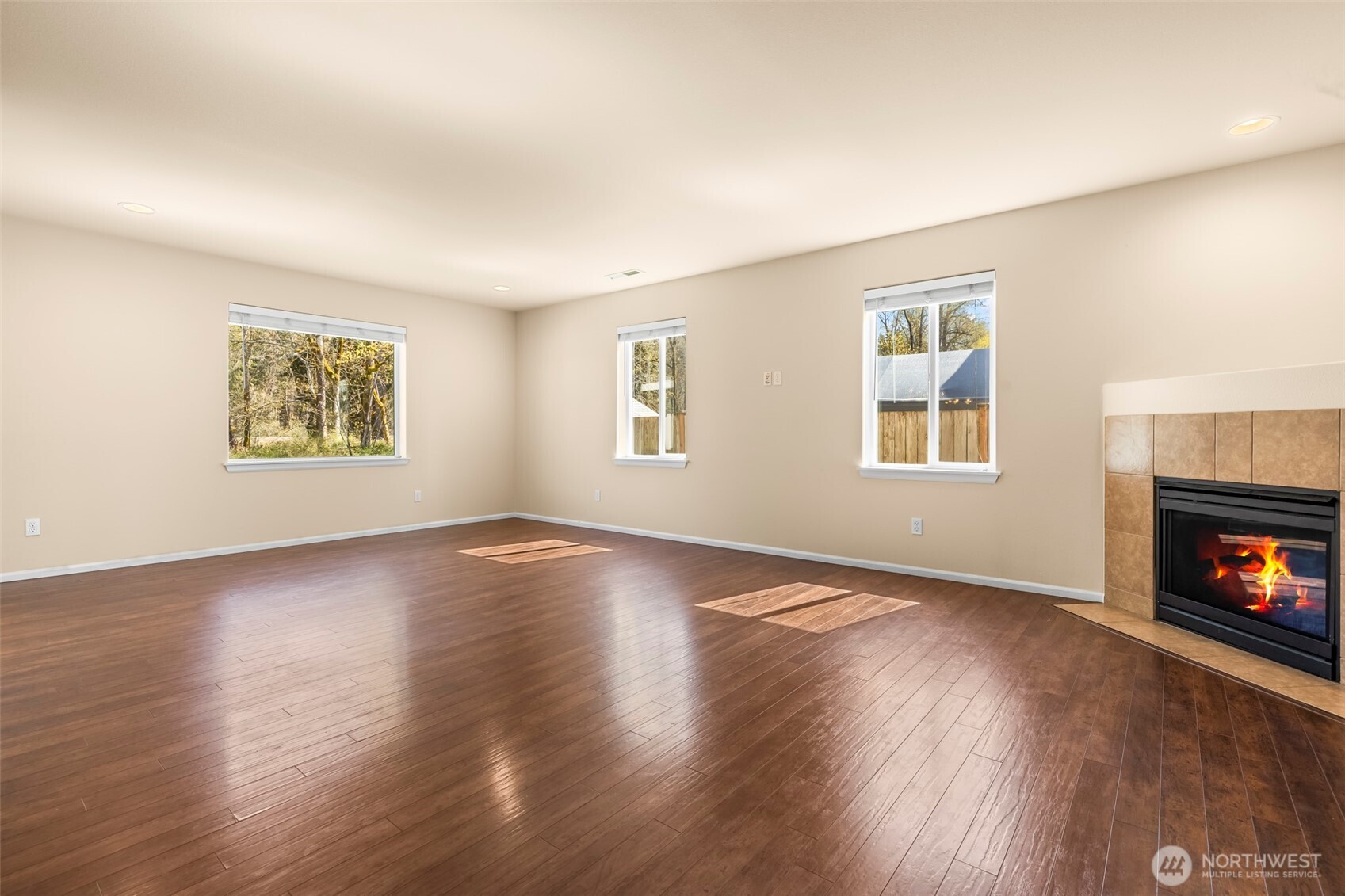 1408 Daffodil Avenue Northeast Orting, WA 98360 - Photo 8 of 37 a view of an empty room with window and wooden floor