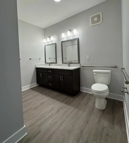 a bathroom with a glass shower door