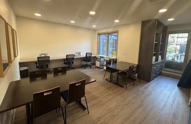a living room with pool table gym equipment