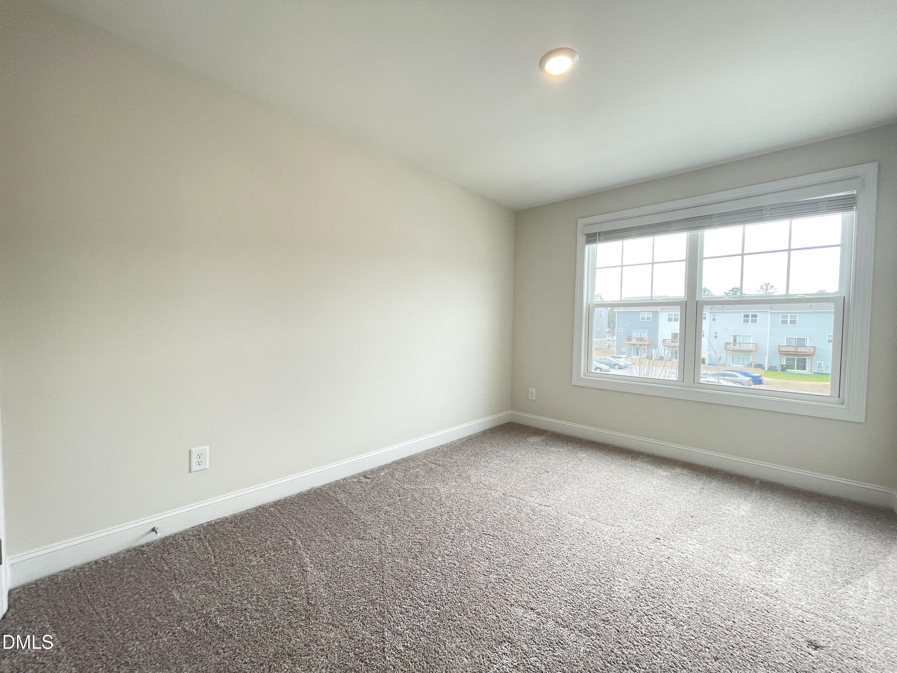 6911 Outfall Point Lane Raleigh, NC 27616 - Photo 20 of 34 an empty room with windows