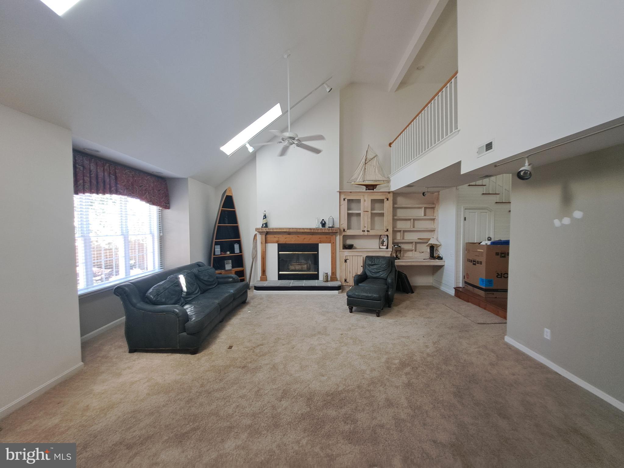 123 New Road Lewes, DE 19958 - Photo 9 of 29 a living room with furniture and a fireplace