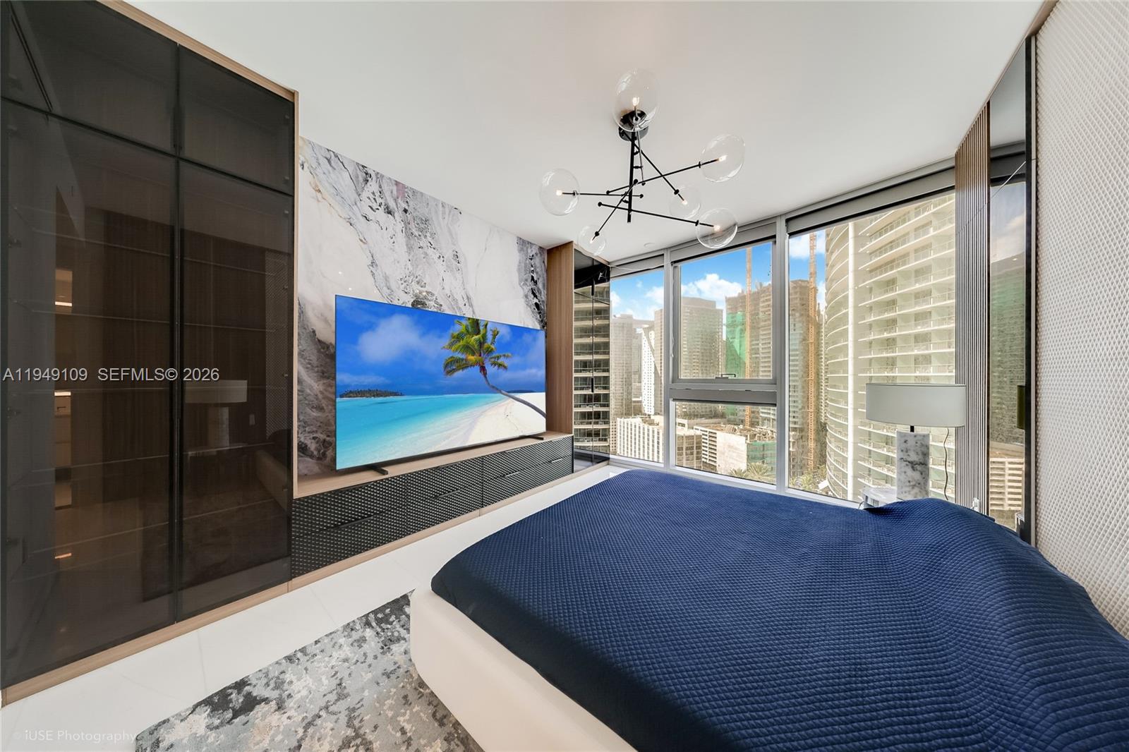 300 Biscayne Blvd Way, Unit 2307W Miami, FL 33131 - Photo 14 of 22 a large bedroom with bed and wooden floor