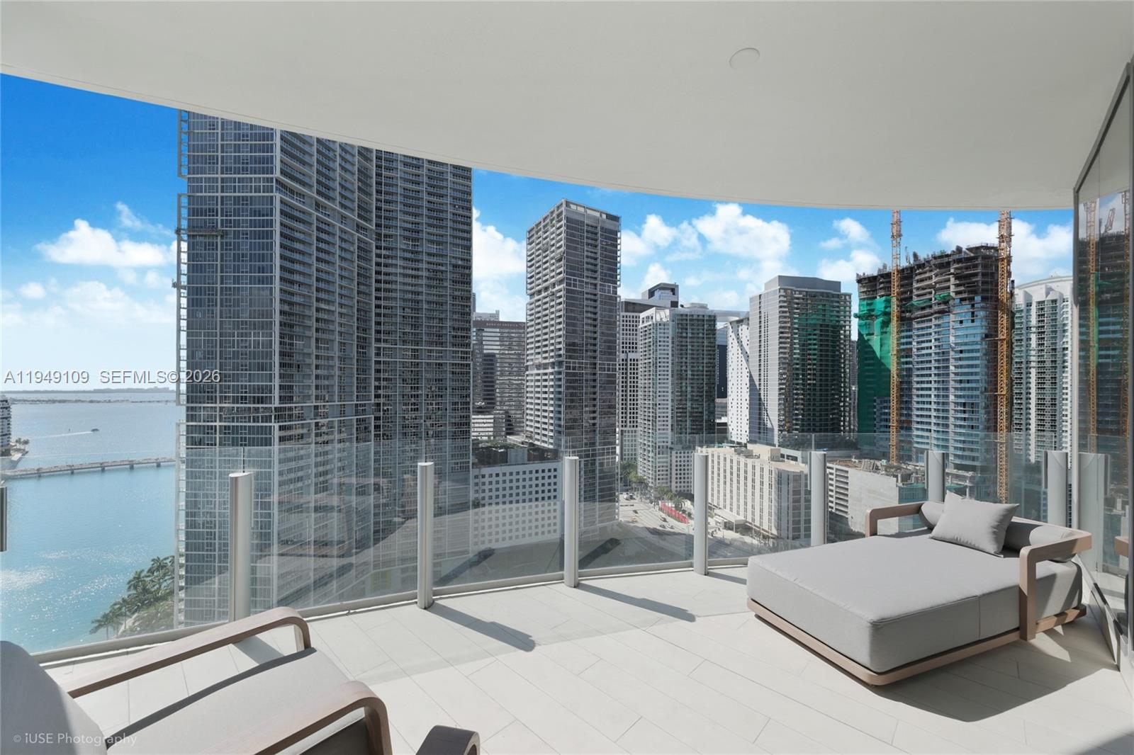 300 Biscayne Blvd Way, Unit 2307W Miami, FL 33131 - Photo 16 of 22 a balcony with table and chairs