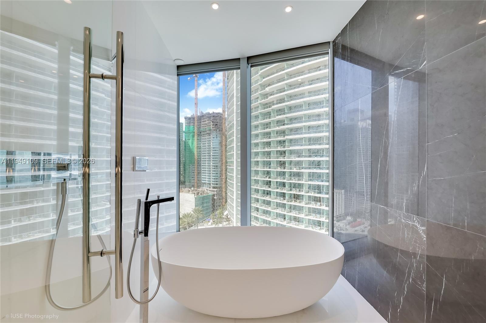 300 Biscayne Blvd Way, Unit 2307W Miami, FL 33131 - Photo 8 of 22 a bathroom with a bathtub and a shower