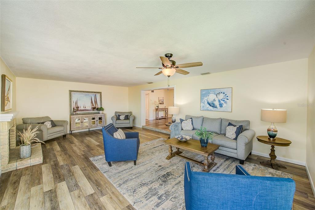 14079 Victoria Road Largo, FL 33774 - Photo 5 of 46 a living room with furniture and a wooden floor