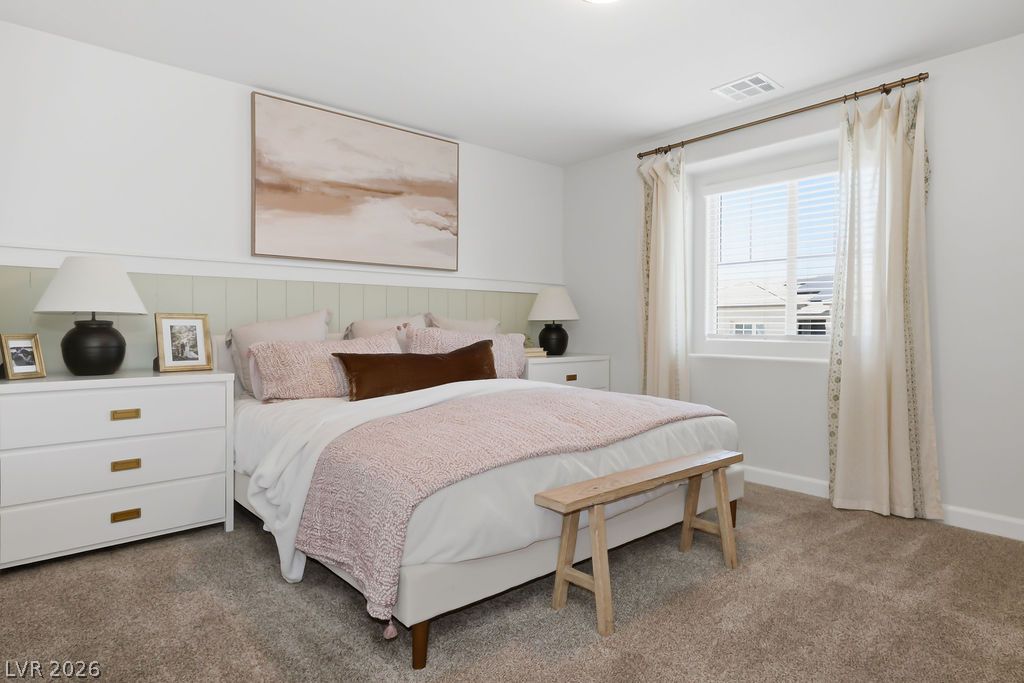 913 Cadence View Way Henderson, NV 89011 - Photo 27 of 46 Plush carpeting and well-lit interiors define this inviting bedroom retreat.