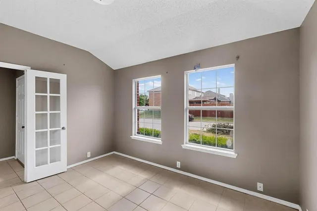 a view of an empty room with windows