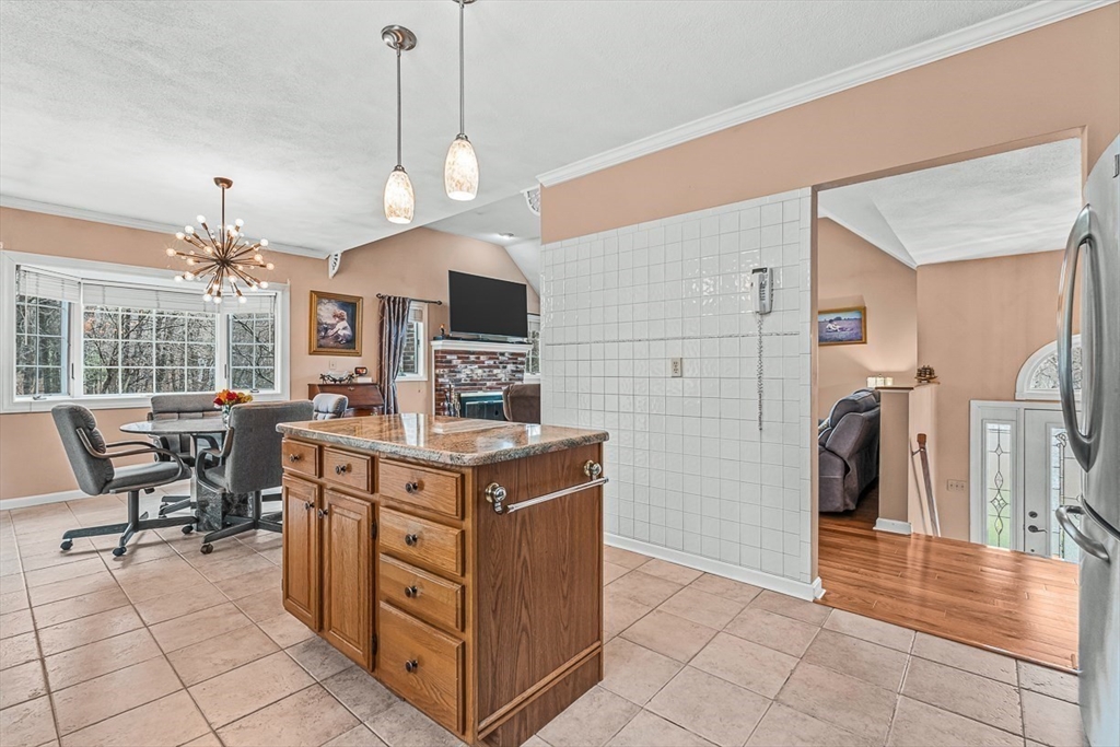 71 Hammersmith Drive Saugus, MA 01906 - Photo 13 of 41 a kitchen with stainless steel appliances granite countertop a stove and a refrigerator