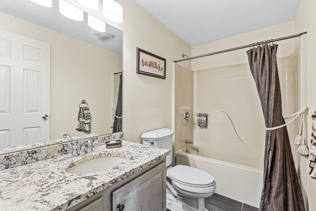 71 Hammersmith Drive Saugus, MA 01906 - Photo 18 of 41 a bathroom with a granite countertop sink toilet and shower