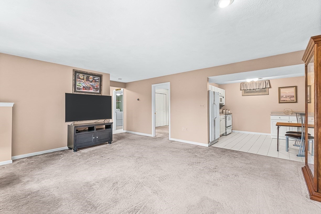 71 Hammersmith Drive Saugus, MA 01906 - Photo 31 of 41 an empty room with furniture and a flat screen tv