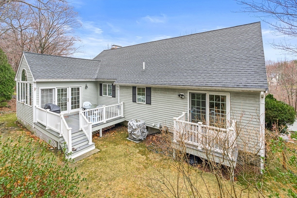 71 Hammersmith Drive Saugus, MA 01906 - Photo 40 of 41 a view of a house with a wooden deck and a barbeque