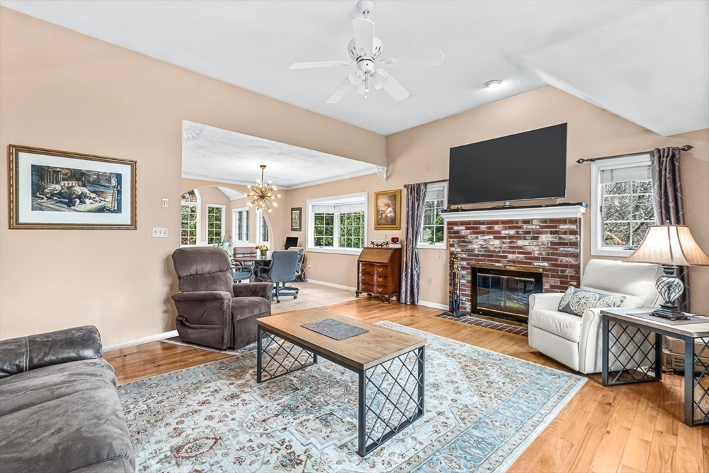 71 Hammersmith Drive Saugus, MA 01906 - Photo 6 of 41 a living room with furniture a flat screen tv and a fireplace