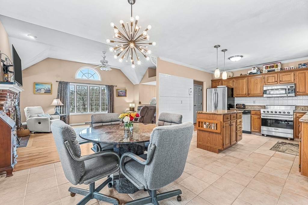 71 Hammersmith Drive Saugus, MA 01906 - Photo 8 of 41 a view of a dining room with furniture window and wooden floor