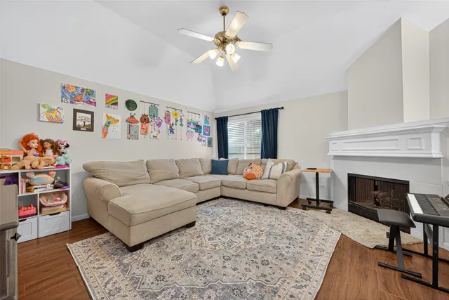 a bathroom with a granite countertop double vanity sink and mirror