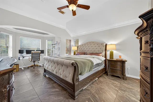 a bathroom with a granite countertop sink a mirror and shower
