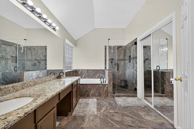 a bedroom with two beds and a chandelier