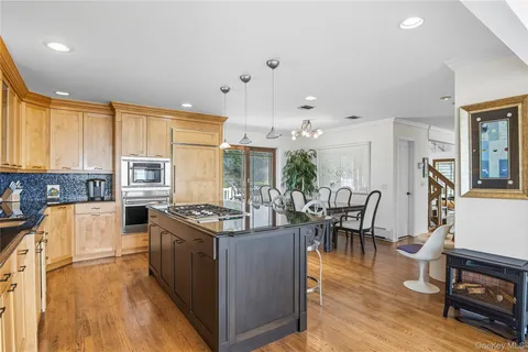 a kitchen with stainless steel appliances granite countertop a stove and a refrigerator