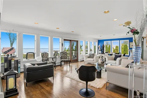 a living room with furniture or couch and a large window