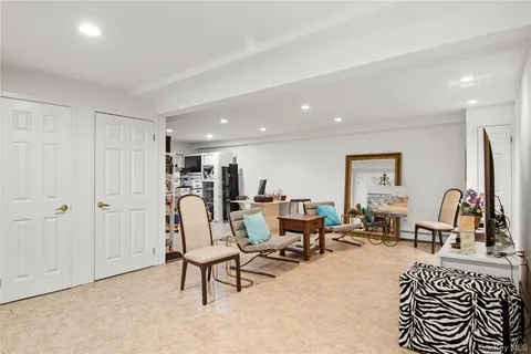 a view of a livingroom with furniture and a flat screen tv