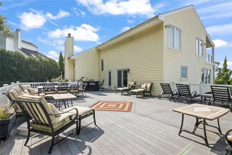 a view of a patio with chairs and tables