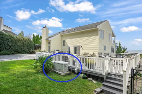 a view of a house with a yard patio and sitting area