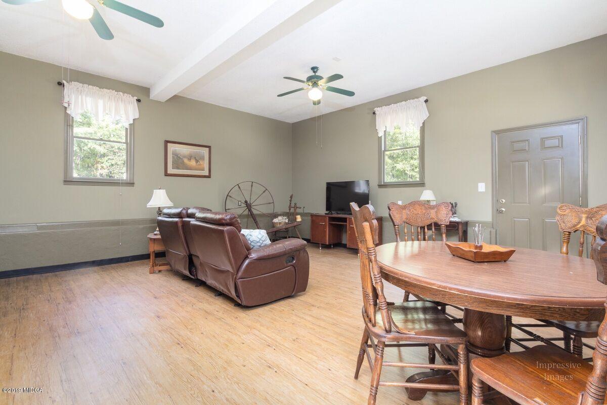 2527 Old Jackson Road Locust Grove, GA 30248 - Photo 22 of 29 a living room with furniture and a table