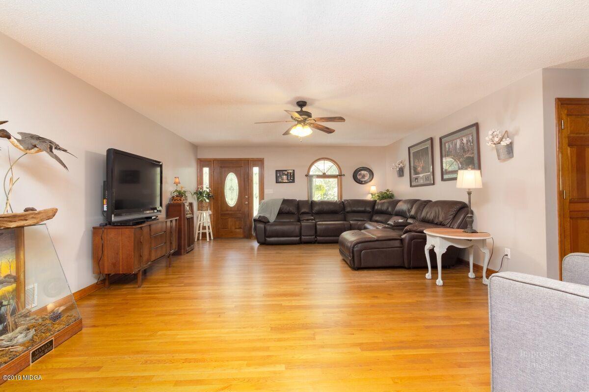 2527 Old Jackson Road Locust Grove, GA 30248 - Photo 8 of 29 a living room with furniture and a flat screen tv