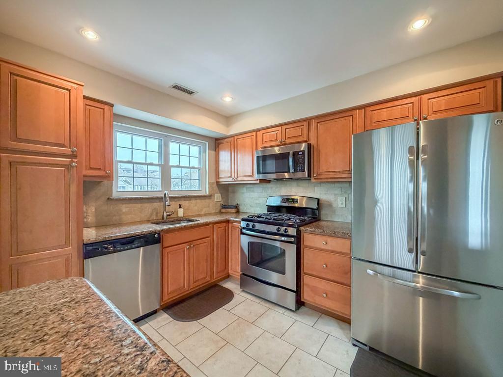 72307 Delaire Landing Road, Unit 307 Philadelphia, PA 19114 - Photo 14 of 39 Offering 2 Breakfast Bars with Granite Countertops