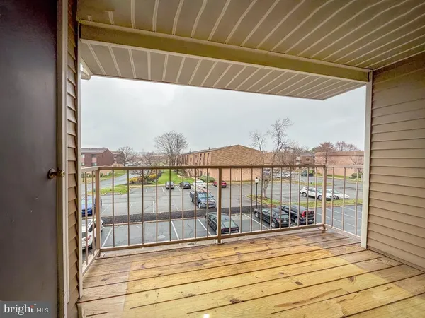a balcony with wooden floor
