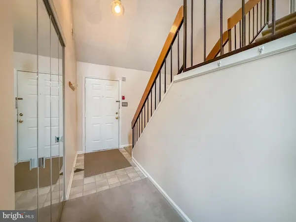 a view of entryway with wooden floor