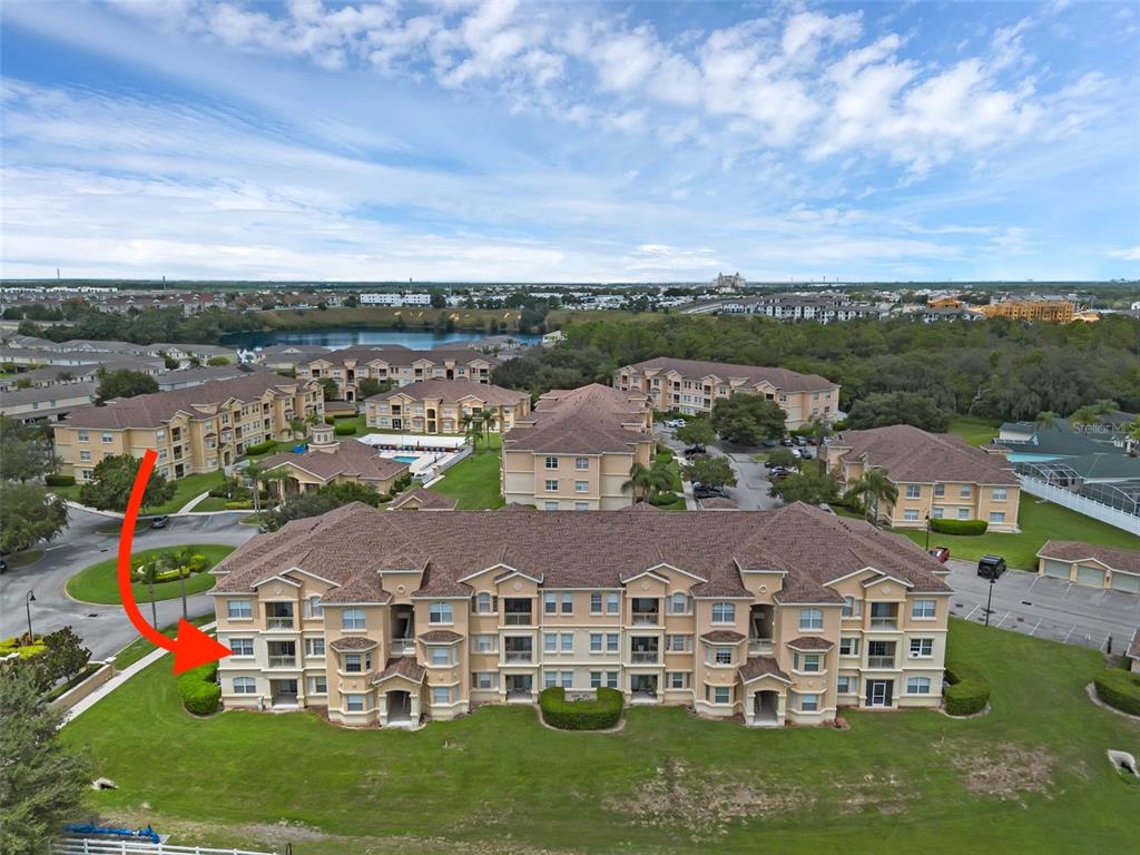 116 Terrace Ridge Circle, Unit 116 Davenport, FL 33896 - Photo 1 of 1 an aerial view of residential houses with outdoor space and trees