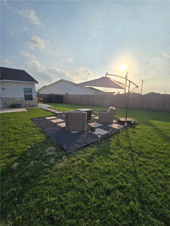 518 Alamo Drive McGregor, TX 76657 - Photo 22 of 41 a view of a patio with table and chairs under an umbrella