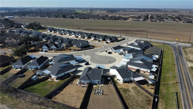 an aerial view of a house with a ocean view