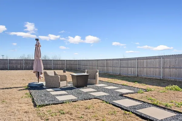 a view of a backyard and a patio