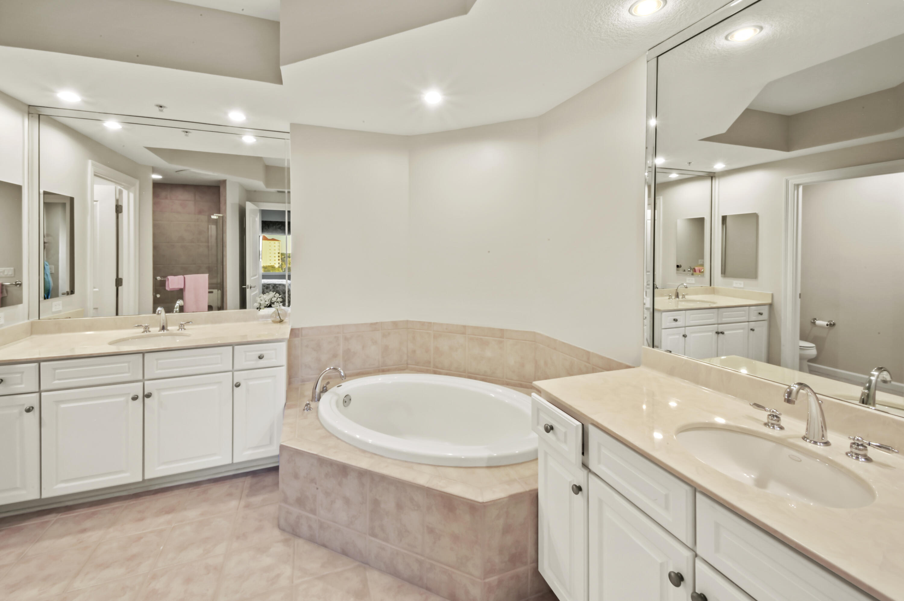 608 Lost Key Drive, Unit 801C Perdido Key, FL 32507 - Photo 12 of 43 a bathroom with a granite countertop sink mirror and bathtub
