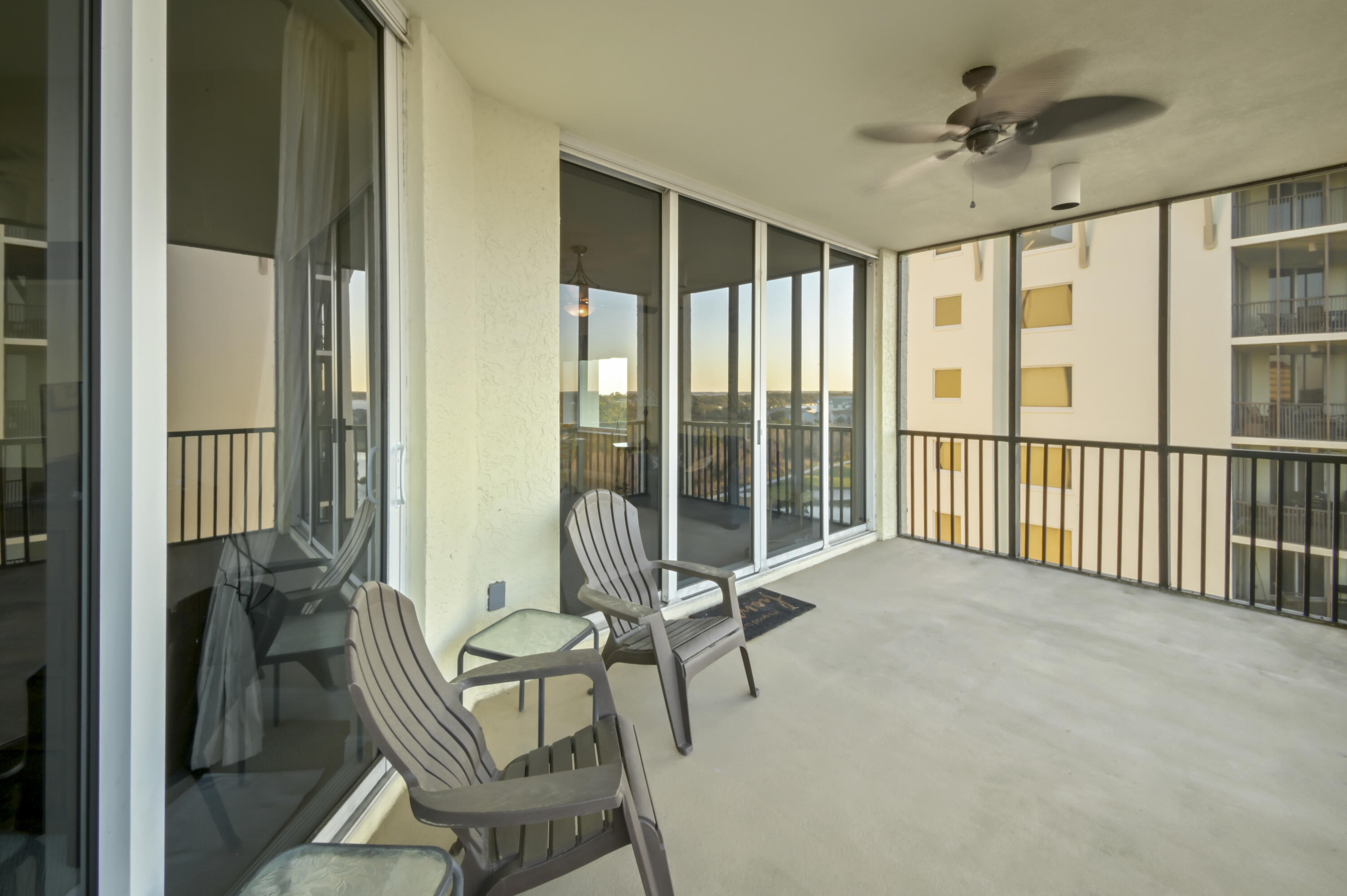 608 Lost Key Drive, Unit 801C Perdido Key, FL 32507 - Photo 18 of 43 a living room with furniture and a floor to ceiling window