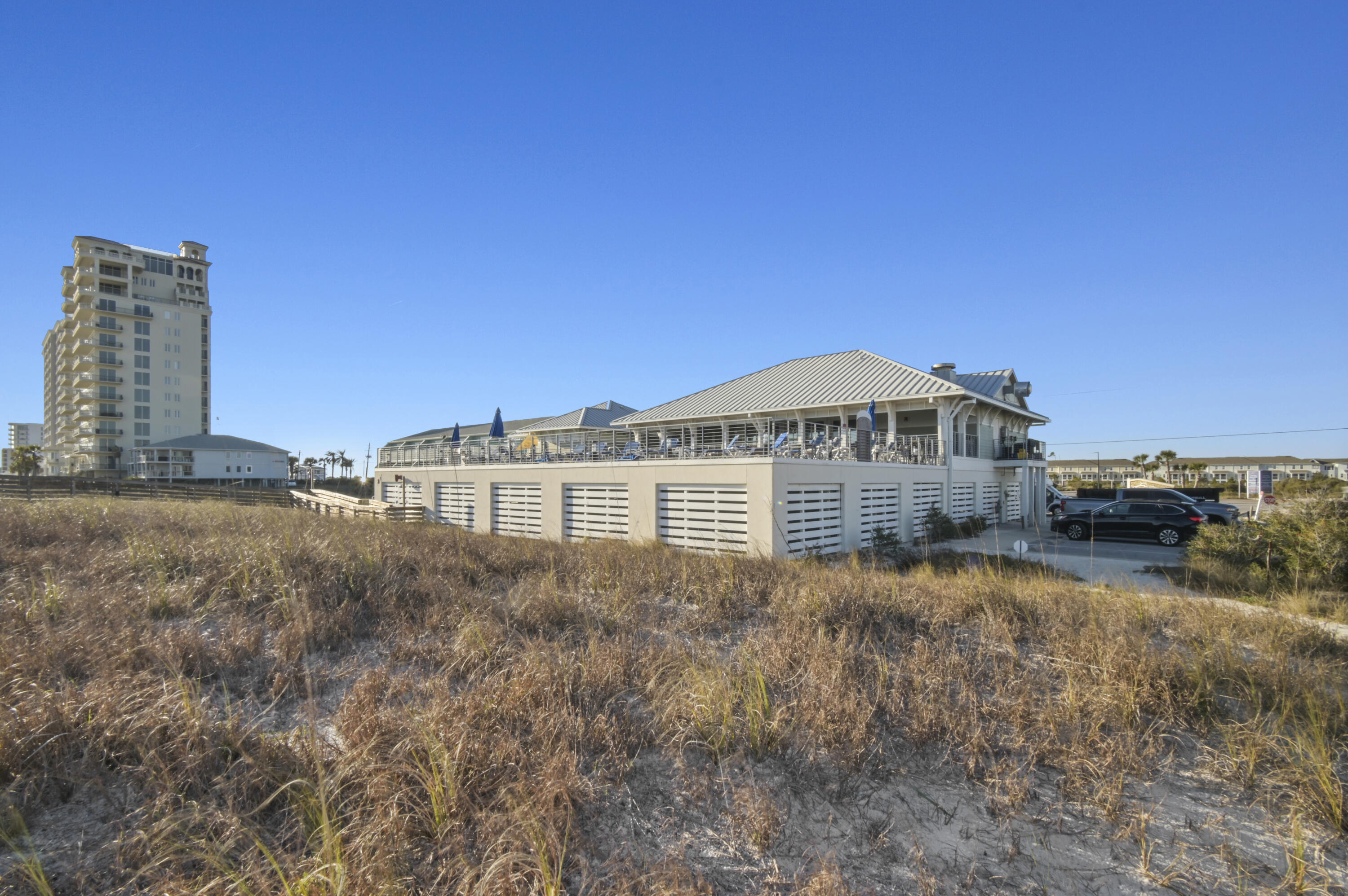 608 Lost Key Drive, Unit 801C Perdido Key, FL 32507 - Photo 2 of 43 a view of a house next to a big yard
